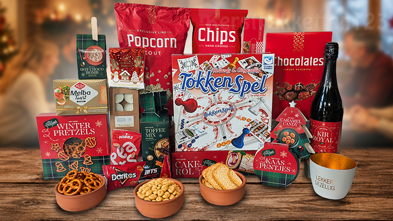 Samen spelen en genieten! Dit gezellige kerstpakket met tokkenspel combineert het Clown Games Tokkenspel met sfeervolle accessoires en volop zoete en hartige lekkernijen.